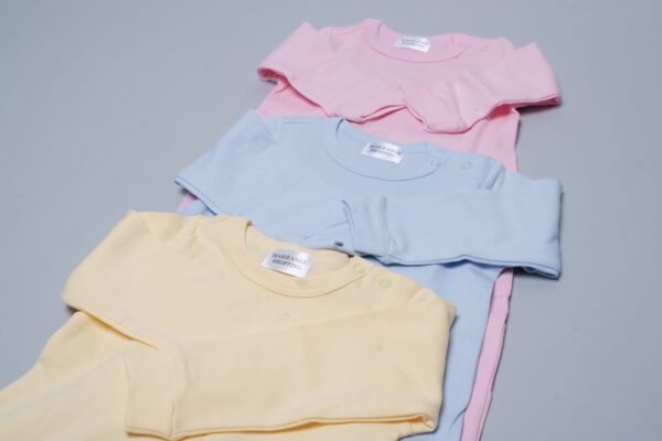 A pair of three sweatshirts in pink, yellow and blue.