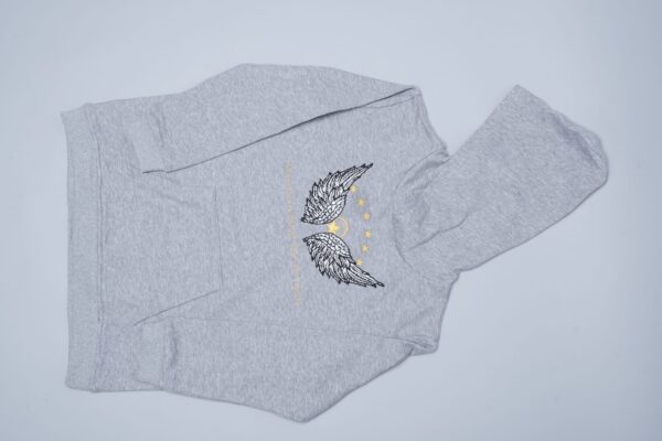 A 100% cotton unisex kids hoodie, size 3T (for a 3-year-old) and 7T (for a 7-year-old), with wings on it.