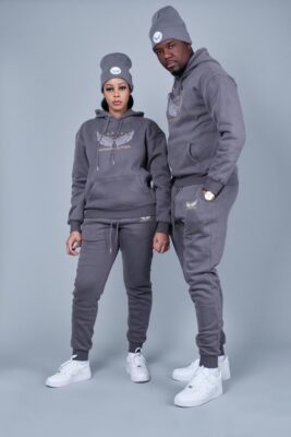 A man and woman wearing gray hoodie and sweatpants.